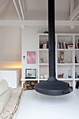 Suspended fireplace, shelving and white floor in living room
