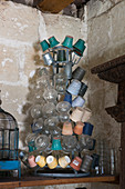 Plant pots and vases on vintage metal bottle drying tree