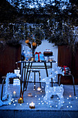 Terrace festively decorated with fairy lights and illuminated figures