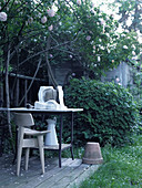 Artist's workplace in shade below climbing rose