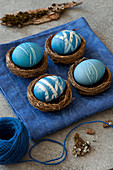 Blue Easter eggs in small baskets