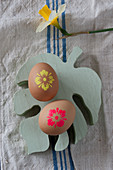 Grey Easter eggs with neon flower motifs