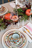 Colourful, Oriental-style crockery on festively set table