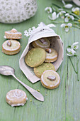 Pistachio biscuits in cone handmade from sheet music with lace trim