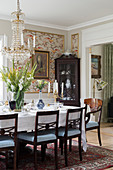Set dining table and dark chairs in classic dining room