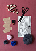 Gift wrapping materials and pompoms