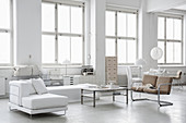 Modern loft-apartment living room decorated entirely in white