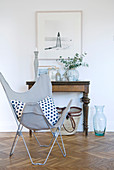 Polka-dot Butterfly Chair in front of old console table