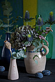Autumn bouquet of hydrangeas, sea holly 'Supernova', eucalyptus and sea lavender