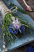 Hyacinths and bilberry branches tied with jute cord