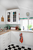 Country-house kitchen with retro accessories and chequered floor