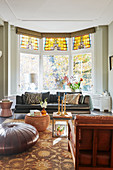 Classic living room in shades of brown with bay window