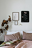 Feminine bedroom with botanical pictures