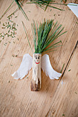 Angel made from wood, paper wings and pine-needle hair