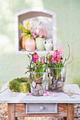 Hyacinths and pebbles in glass vases