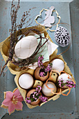 Romantic Easter arrangement with heather and eggs in egg box
