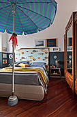 Parasol in classic bedroom with maritime accessories