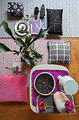Moodboard of patterned accessories in grey and pink