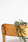 Christmas arrangement on chair backrest