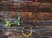 Scented wreaths decorated with shapes cut out of orange peel