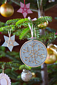 Christmas-tree decoration: embroidered snowflake in embroidery frame