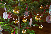 Handmade Christmas-tree decorations and golden baubles