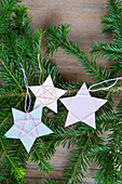 Christmas-tree decorations handmade from paper and yarn