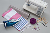 Cloth, oilcloth, wool, iron and sewing machine