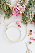 Materials for a spring wreath: wooden hoops and dried flowers