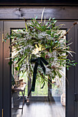 Oppulent door wreath with velvet bow