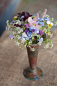 Spring bouquet of aquilegia, forget-me-nots, cow parsley, chive flowers, strawberry flowers and knotweed
