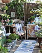 Comfortable seating area on shabby-chic terrace