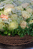 Roses, box and gypsophila arranged as a cake