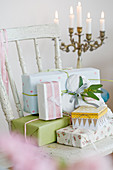 Wrapped gifts in pastel on an old chair