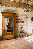 Old cupboard with a mirror door in a rustic country house