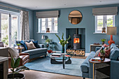 Wood-burning stove in niche in classic blue living room