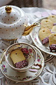 Biscuits shaped like a tea bag in a teacup