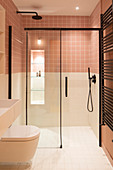 Floor-level shower in small bathroom with two-tone walls