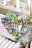 Heart wreath made from hydrangea blossoms and snowberries
