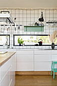 Ribbon windows in white, modern kitchen