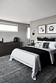 Classic, elegant, hotel-style bedroom decorated in shades of grey