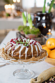 Christmas bundt cake with icing and cranberries