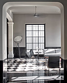 Modern, monochrome living room in luxurious period building
