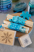 Blue decorative ribbons on clothes pegs