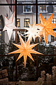 Christmas stars arranged in window