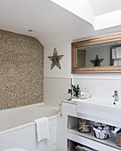 Beige Pebble tiles in white bathroom