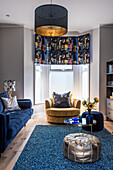 Elegant living room in blue, grey metallic with bay window