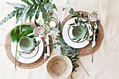 Summery place settings for two with Mediterranean greenery