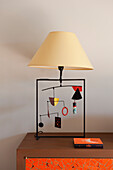 Table lamp; mobile in lamp base