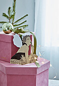 Pink gift box with vintage angel made of paper